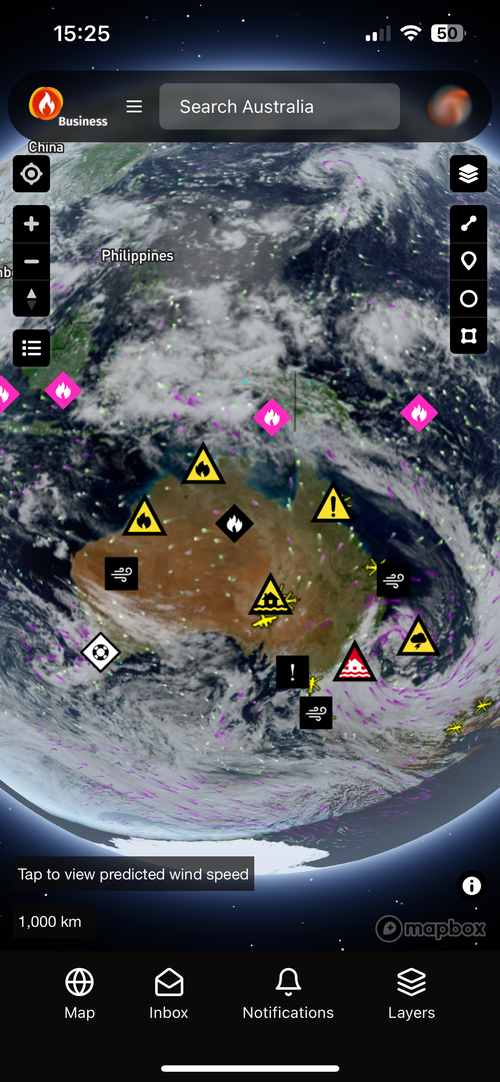 Bushfire.io Business on a phone with satellite cloud imagery and Possible Fire Ignitions over Australia